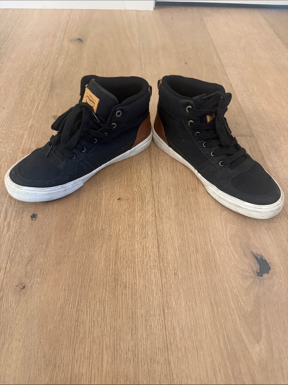 Levi's Black High-Top Sneakers with Brown Heel Accent